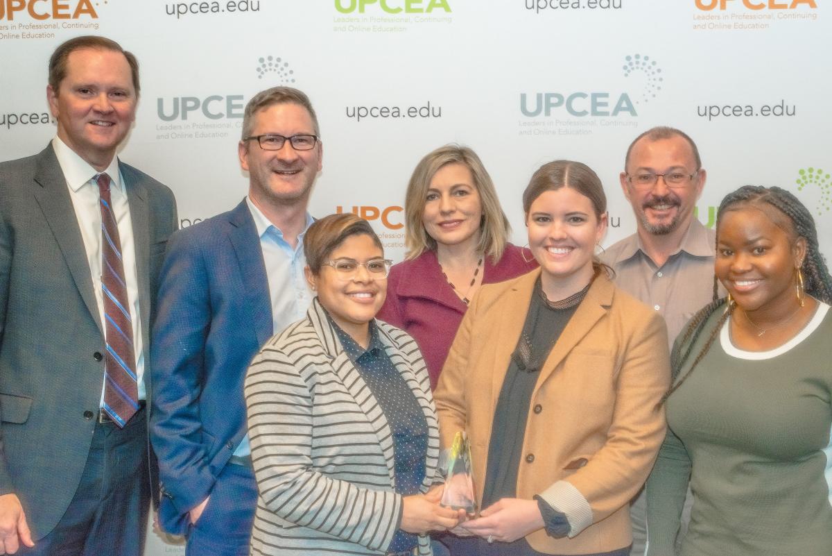 GTPE Marketing Team poses with UPCEA President after winning Best in Show