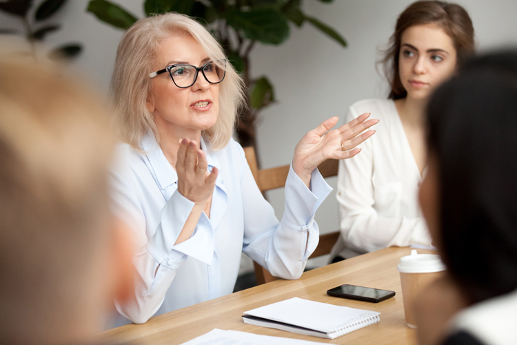 Female professional leading a business meeting