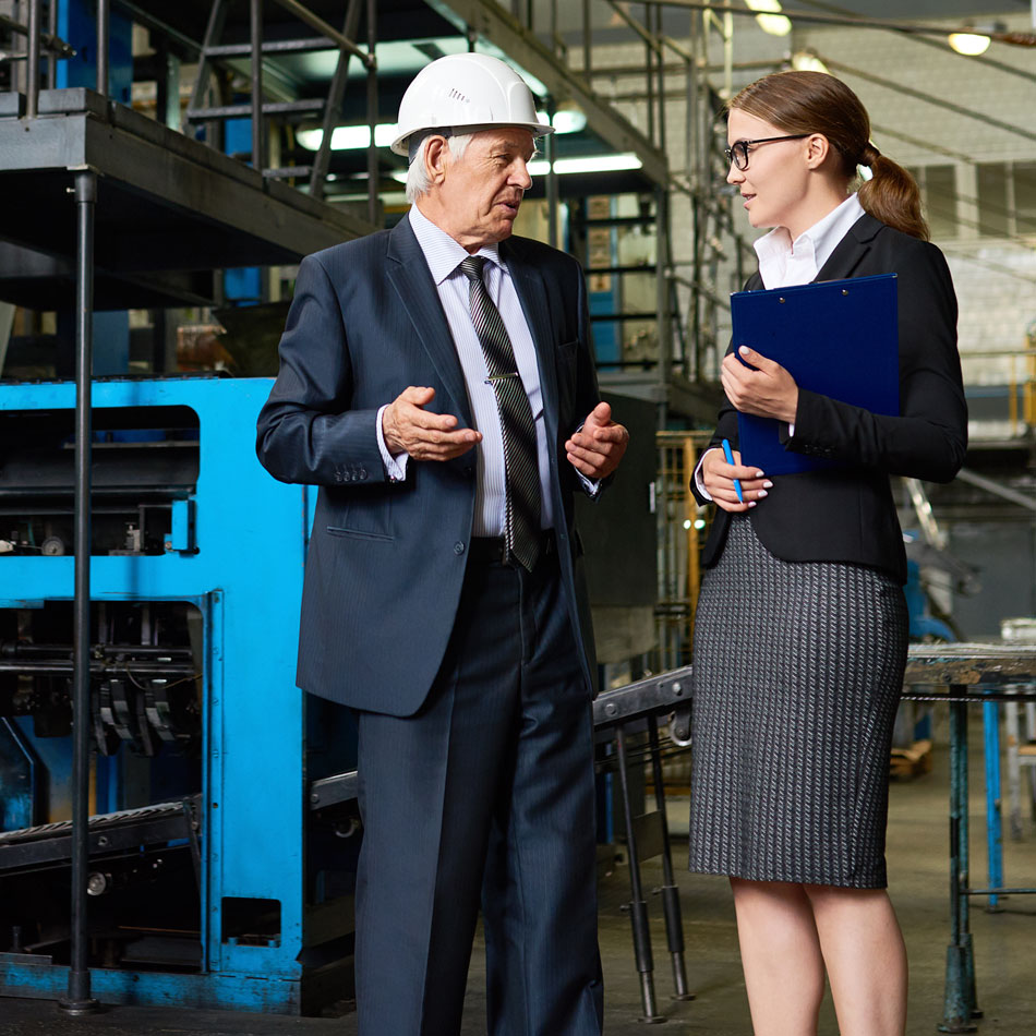 Manufacturing professionals collaborating in a warehouse