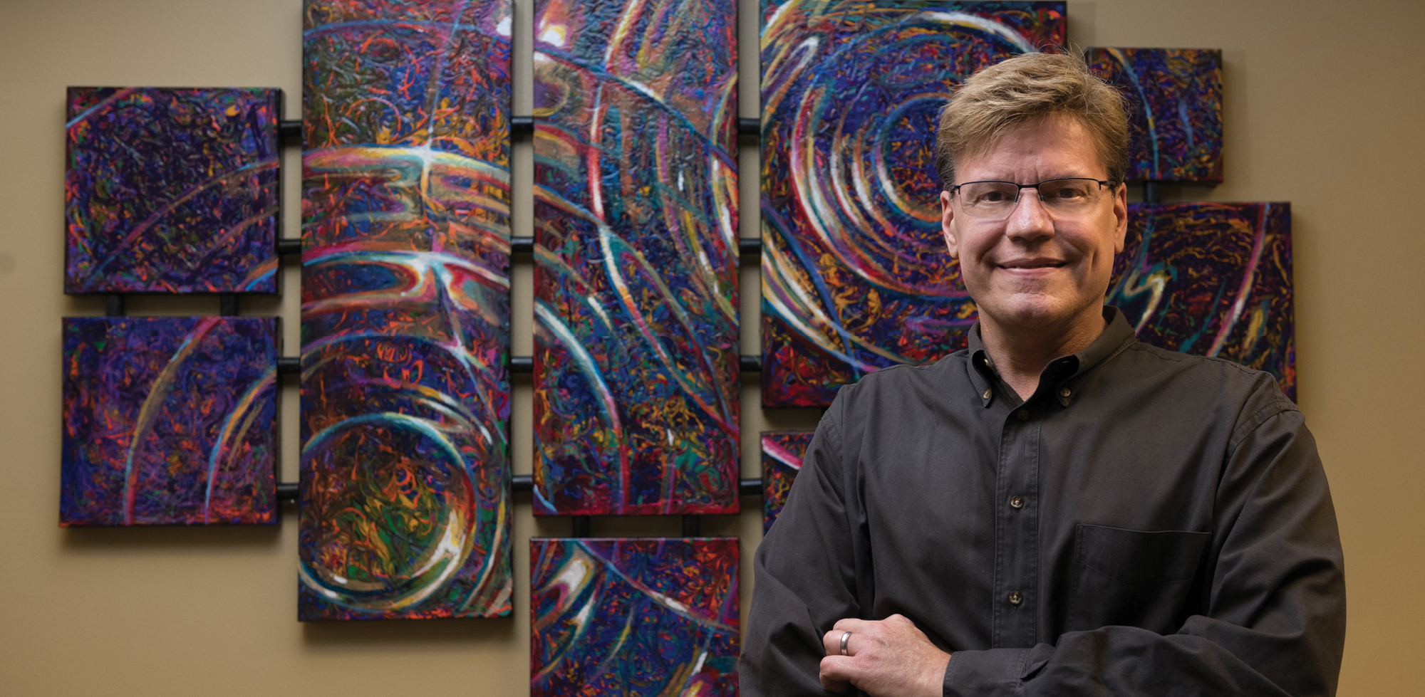 Make a Splash Painting Bobby Strickland in front of painting