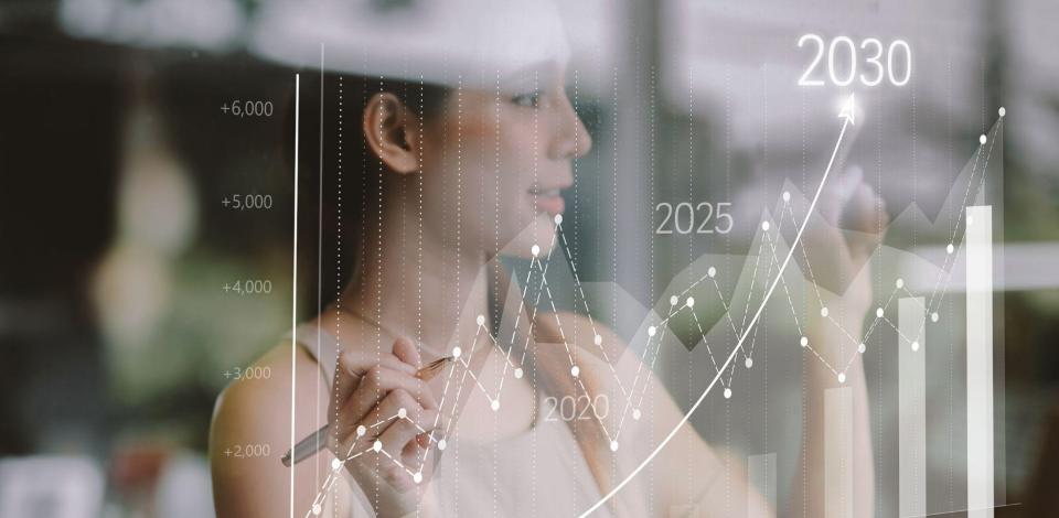 Women in front of glass board looking at a timeline