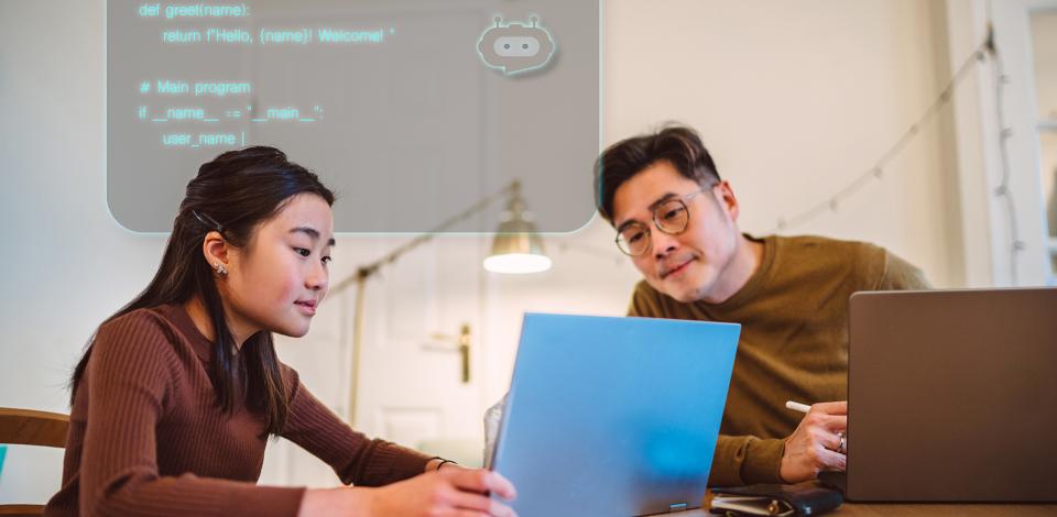 Man and woman using AI to code on a laptop