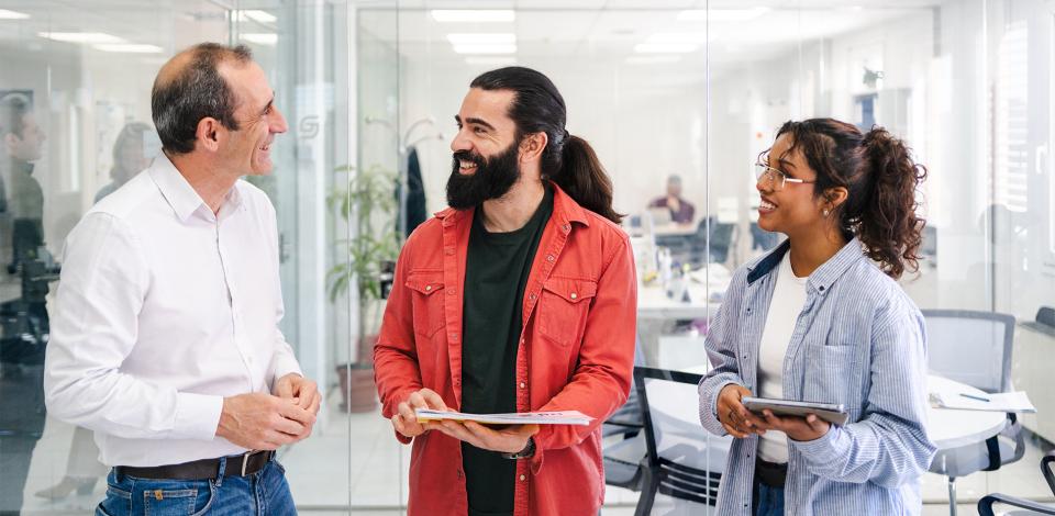 Coworkers speaking together at meeting