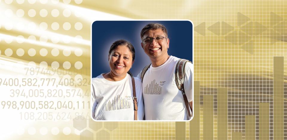 Man and woman smiling, stand side-by-side in white t-shirts against a gold background.