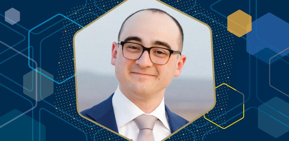 A professor, shown in a close-up portrait against an abstract graphic backdrop.