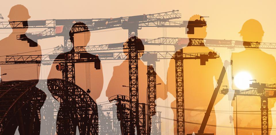 Silhouette of workers in PPE over an image of mechanical cranes.  