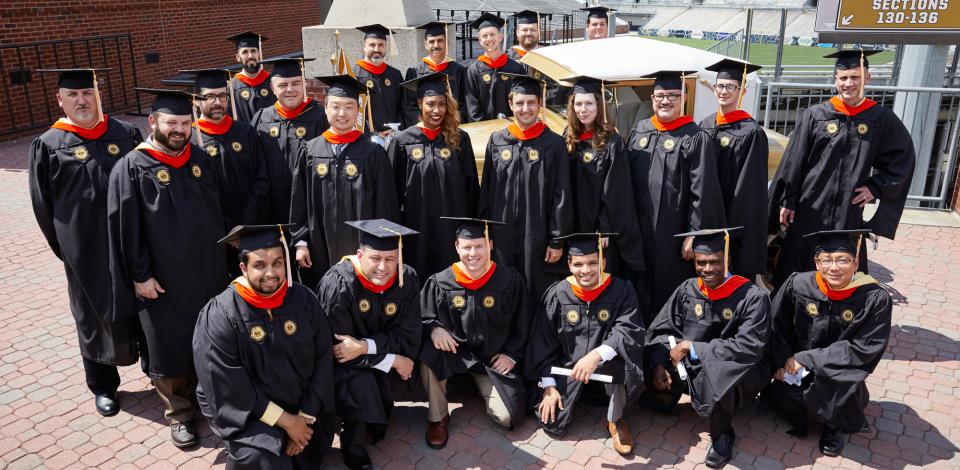 Georgia Tech Online Master's Graduates Group of Georgia Tech graduates posing in their caps and gowns