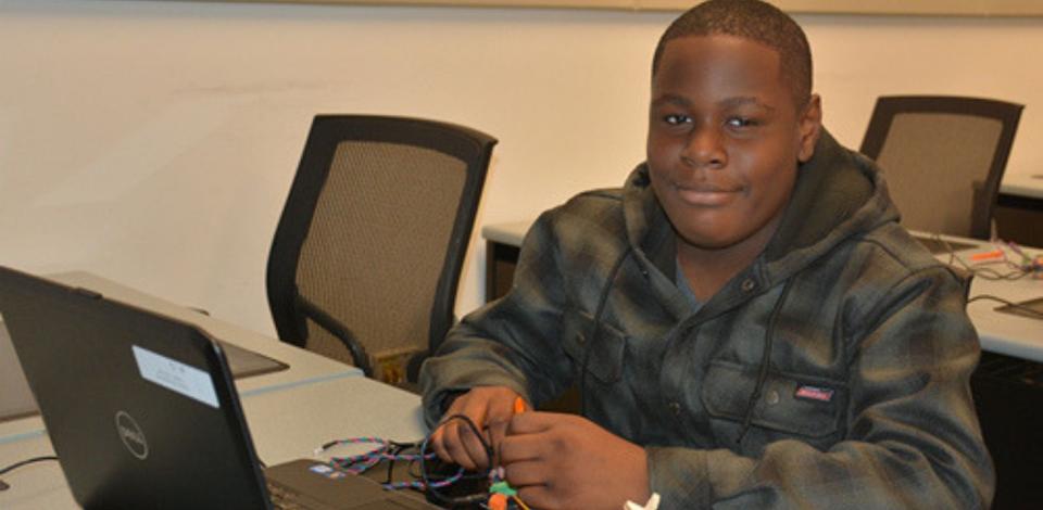 K-12 student working on robotic project