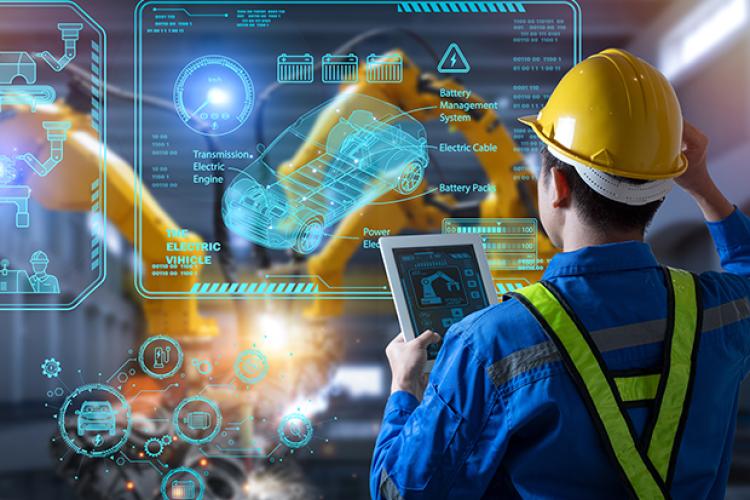 man in hard hat looking at planning diagram