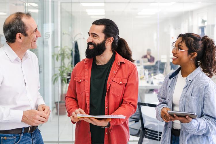 Coworkers speaking together at meeting