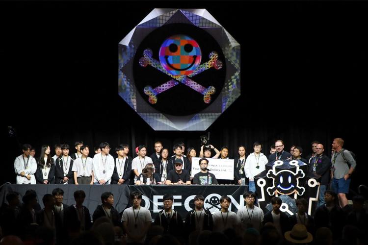 Taesoo Kim's team on stage after winning the $4 million grand prize at DARPA’s AI Cyber Challenge