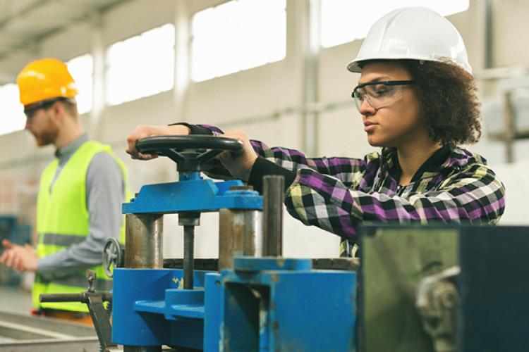 OSHA professional working on factory line floor