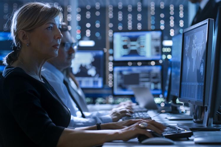 A woman working on a cybersecurity project