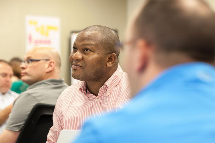 Working professionals attending a Defense Tech course