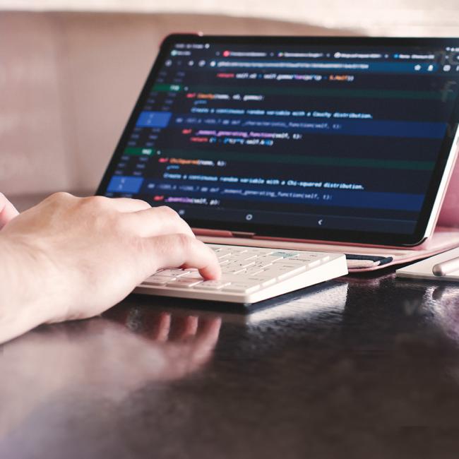 A person typing on a keyboard