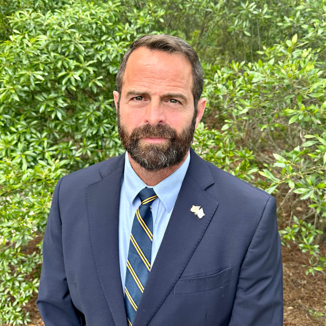 Professional Headshot of James Wilburn in an outdoor setting