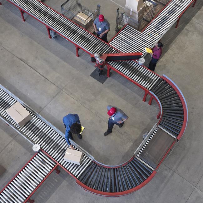Worker working at conveyor belt 