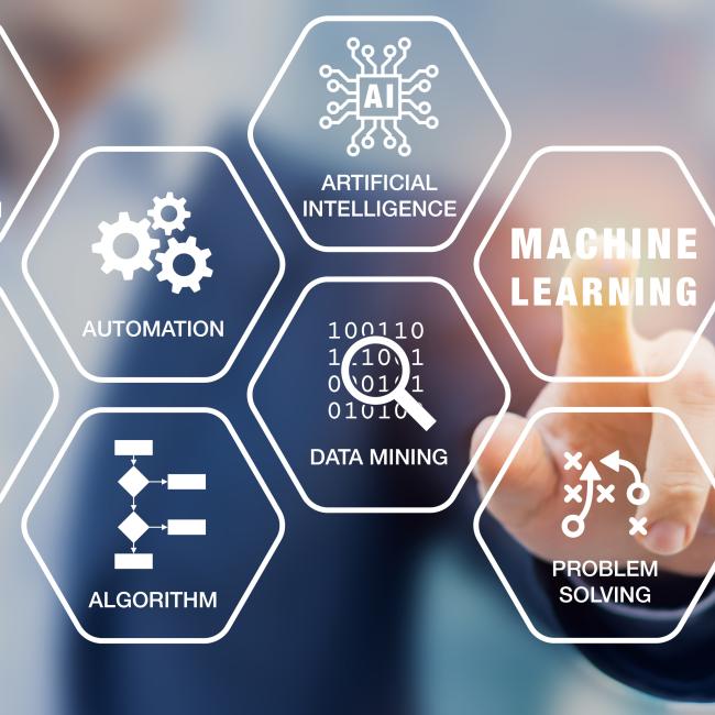 person pointing at "Machine Learning" on a screen showing hexagon's depicting different machine learning elements