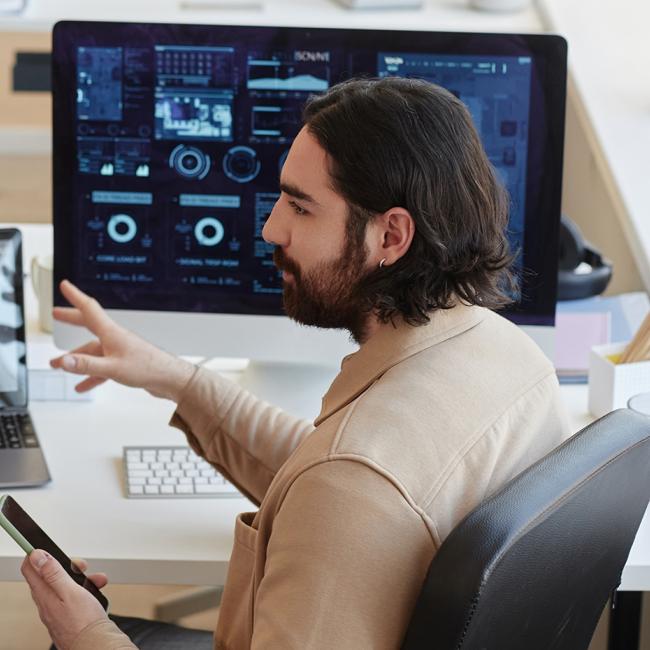 Two coworkers discussing data dashboards