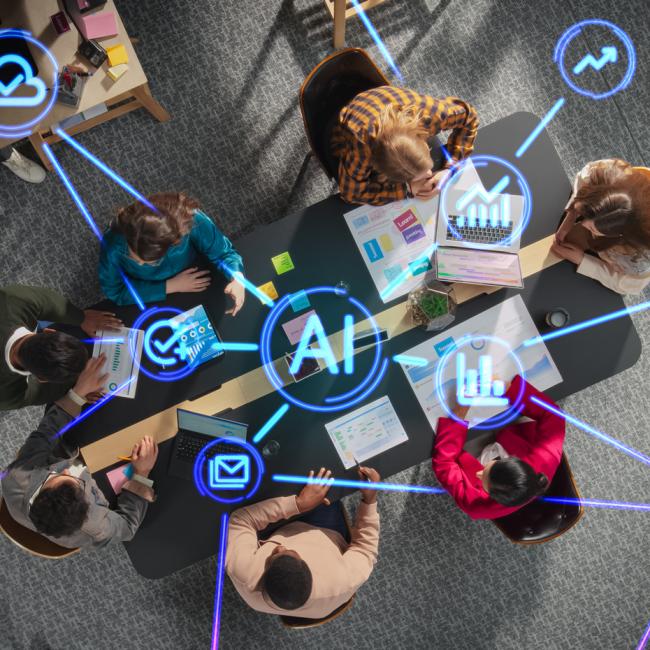 A team collaborates in an office while digital icons representing AI, connectivity, and cybersecurity appear throughout the workspace. 