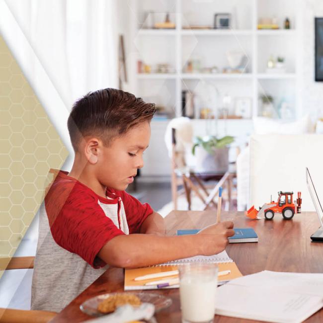 Dad works from home while helping son with homeschool